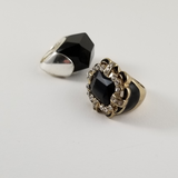 Ring 1 is black stone in a light weight setting.  Ring 2 Black and Rhinestone Rings. The Center if facetted 